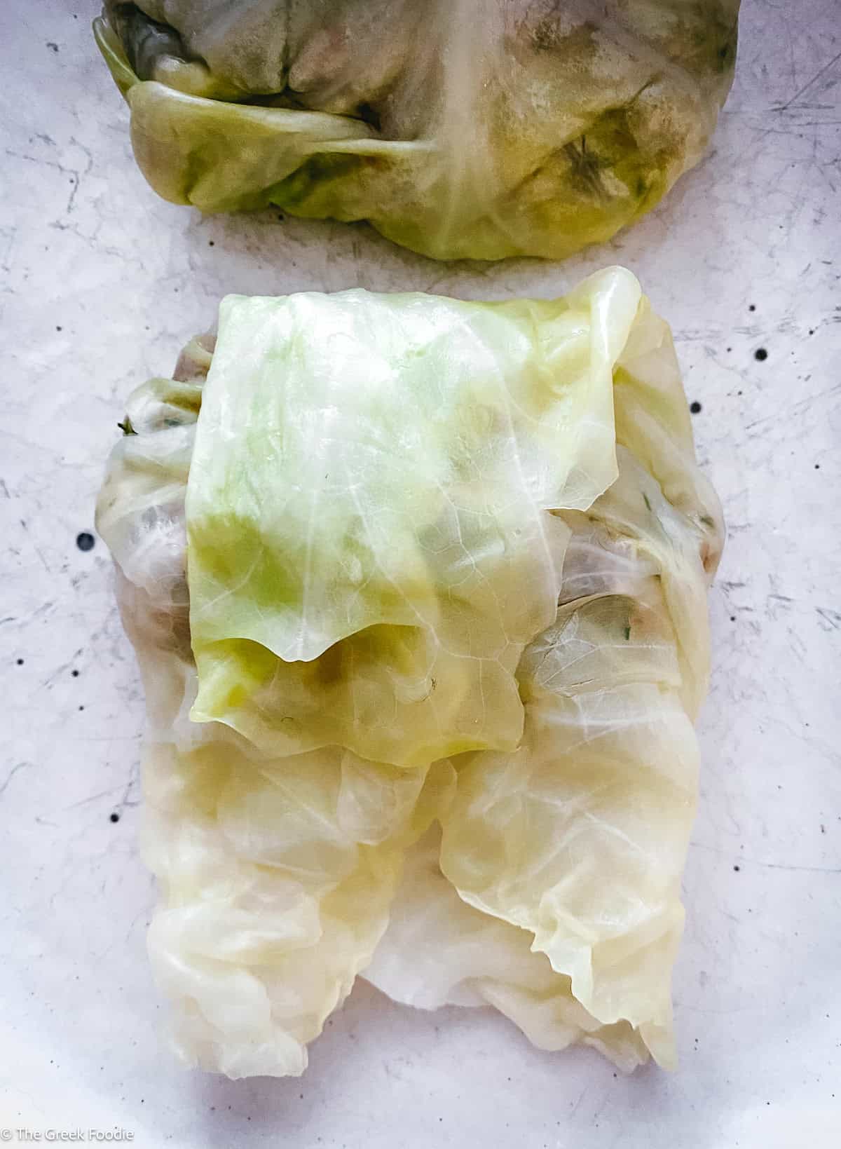 Finished Greek cabbage roll, wrapped and ready for the pot