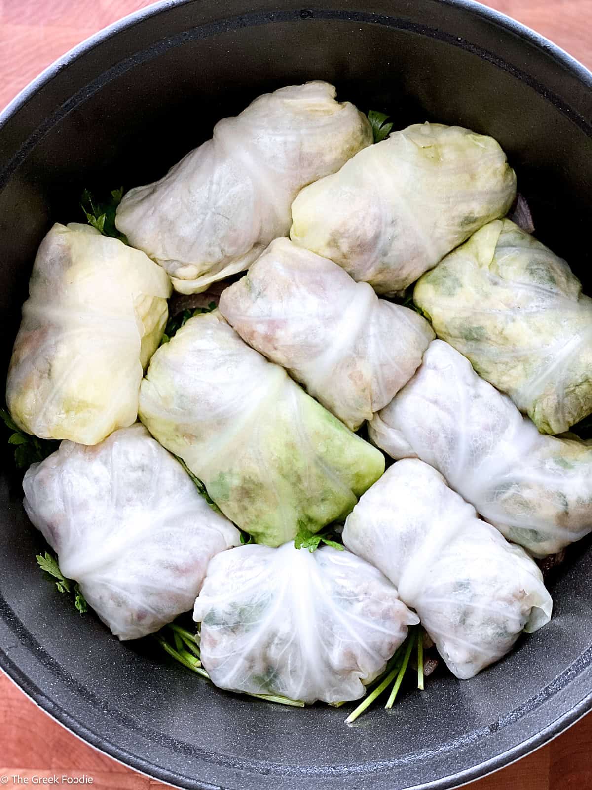Lahanodolmades packed in tight rings in the pot before adding liquid