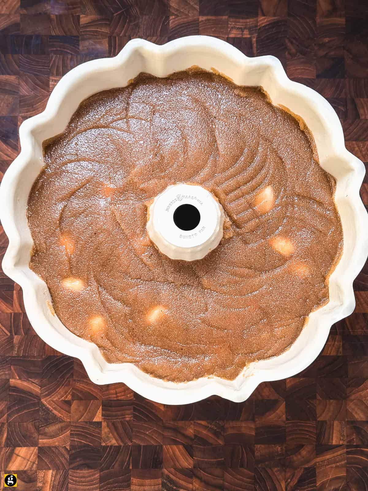 Semolina halva pressed into an oiled bundt pan, seen from above