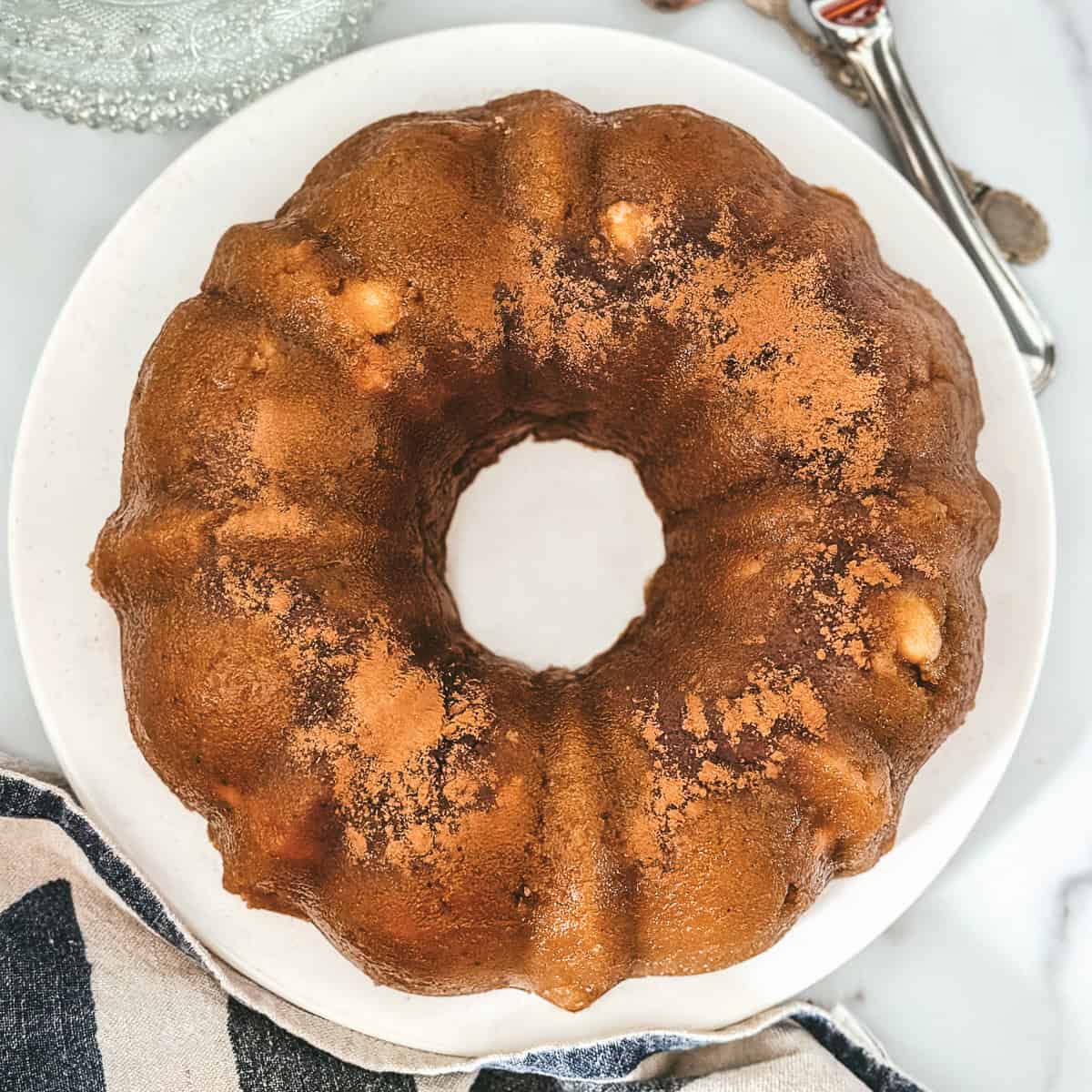 Greek semolina halva with toasted almonds, dusted with cinnamon